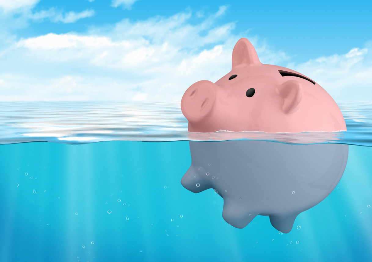 Piggy bank sinking, savings loss concept