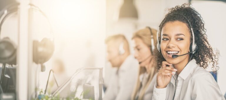 call center worker at desk with her team