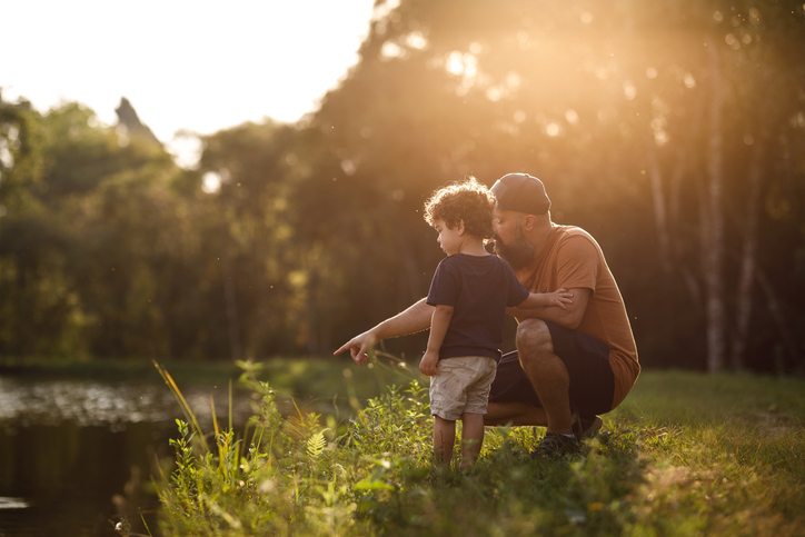 Father showing lake to his son